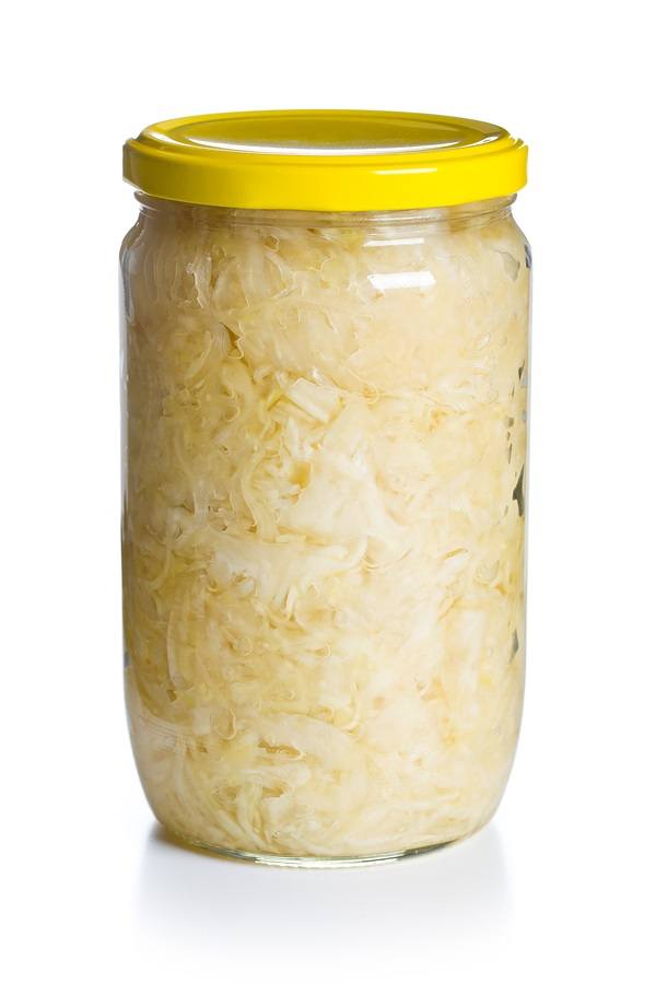 sauerkraut in jar on white background