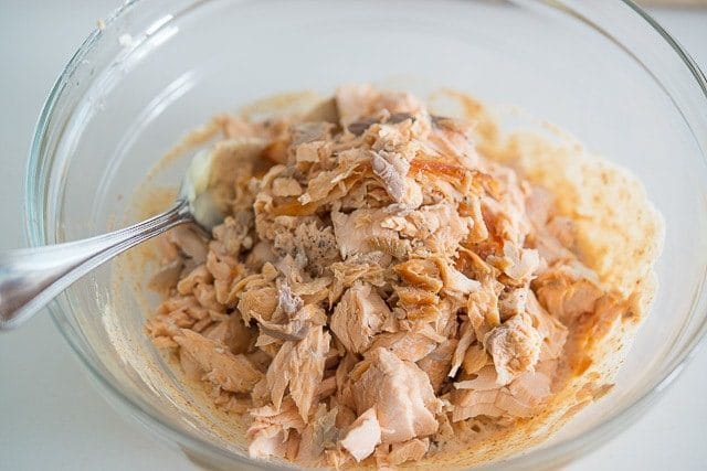 Flaked Fresh Salmon Added to Mayonnaise Dressing In Bowl