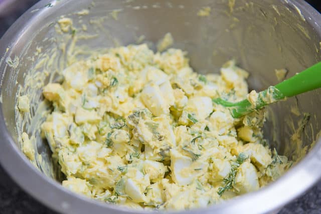 Mixed Egg Salad Ingredients in Mixing Bowl